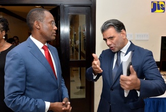 Finance and the Public Service Minister, Dr. the Hon. Nigel Clarke (left) listens attentively to a point made by LatinFinance’s Chief Executive Officer, Taimur Ahmad, at the third Caribbean Finance and Investment Forum, at The Jamaica Pegasus hotel in New Kingston on November 1.