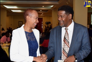 Minister without Portfolio in the Ministry of Finance and the Public Service, Hon. Fayval Williams (left), greets Vice Chairman, Government of Jamaica Audit Commission, Collin Greenland, during the annual Audit Committees’ Conference at The Knutsford Court Hotel in New Kingston on Wednesday (October 31). The event was held under the theme: ‘Audit Committees: Combatting Corruption, Promoting Transparency’.