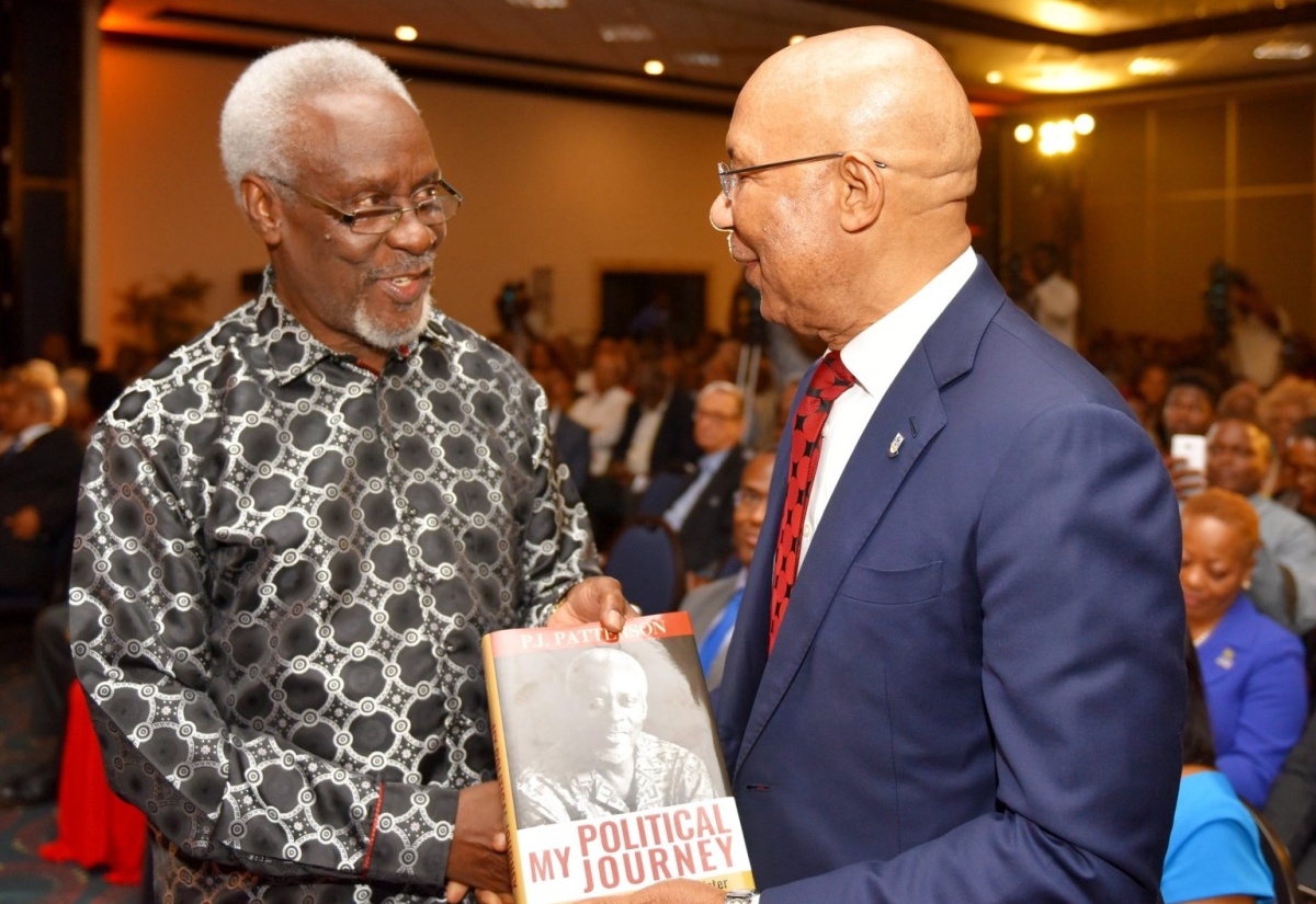 Governor-General, His Excellency the Most Hon. Sir Patrick Allen (right), is presented with a copy of ‘My Political Journey’, by author, former Prime Minister, the Most Hon. P.J. Patterson, at the launch of the publication, at The Jamaica Pegasus hotel in New Kingston on Wednesday (December 12).