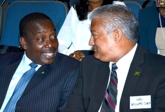 Transport and Mining Minister, Hon. Robert Montague (left), converses with Jamaica Civil Aviation Authority (JCAA) Director General, Nari Williams-Singh, during Thursday’s (December 6) opening ceremony for the second annual two-day aviation seminar, at the Courtleigh Auditorium in New Kingston. Mr. Montague was the keynote speaker. The event is jointly hosted by the JCAA, Airports Authority of Jamaica (AAJ) and Aeronautical Telecommunications Limited (AEROTEL) under the theme ‘Air Transport as an Engine of Economic Development in Jamaica and the Caribbean’.