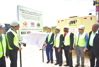 Prime Minister, the Most Hon. Andrew Holness (second left); and Minister of Industry, Commerce, Agriculture and Fisheries,  Hon. Audley Shaw (third left), unveil  a sign at the well site for the Essex Valley Agriculture Development Project in Lititz, St. Elizabeth, following the launch of the project on Wednesday, January 16. Sharing the moment (from left) are Head of the United Kingdom Department for International Development in the Caribbean, Stefan Kossoff; British High Commissioner to Jamaica, His Excellency Asif Ahmad; Member of Parliament for South Manchester, Michael Stewart; President of the Caribbean Development Bank, Dr. William Smith; and Member of Parliament for South East St. Elizabeth, Franklyn Witter.