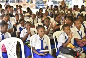 Students at the Clarendon-based Mocho Primary and Infant School, at the official opening of the state-of-the-art resource centre at the institution, recently.