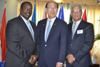 Minister of Transport and Mining, Hon. Robert Montague (left), with Secretary General of the International Maritime Organization, Kitack Lim (centre); and Director General of the Maritime Authority of Jamaica, Rear Admiral (Ret’d) Peter Brady. Occasion was the High Level Symposium for Transport Ministers of the Caribbean Region on Wednesday (February 27), at the Iberostar Hotel in Rose Hall, St. James.