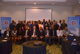 Chairman of the Jamaica Civil Aviation Authority (JCAA), Phillip Henriques (fifth left) and JCAA Director General, Nari Williams-Singh (fourth left), with  participants in the ICAO Senior and Middle Managers Training Programme on Managing Compliance with International Civil Aviation Organisation Standards and Recommended Practices. The training is being held in Jamaica from February 25 to March 1 with participants from five countries across the Caribbean and Central America. 

