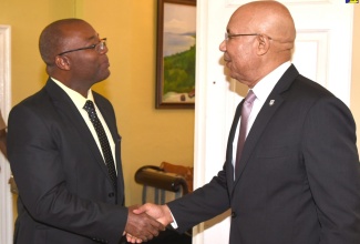 Governor-General, His Excellency the Most Hon. Sir Patrick Allen (right), greets the High Commissioner Designate of the Federal Republic of Nigeria to Jamaica, Esmond St. Clair Reid, when he visited King’s House on Monday (February 11).   