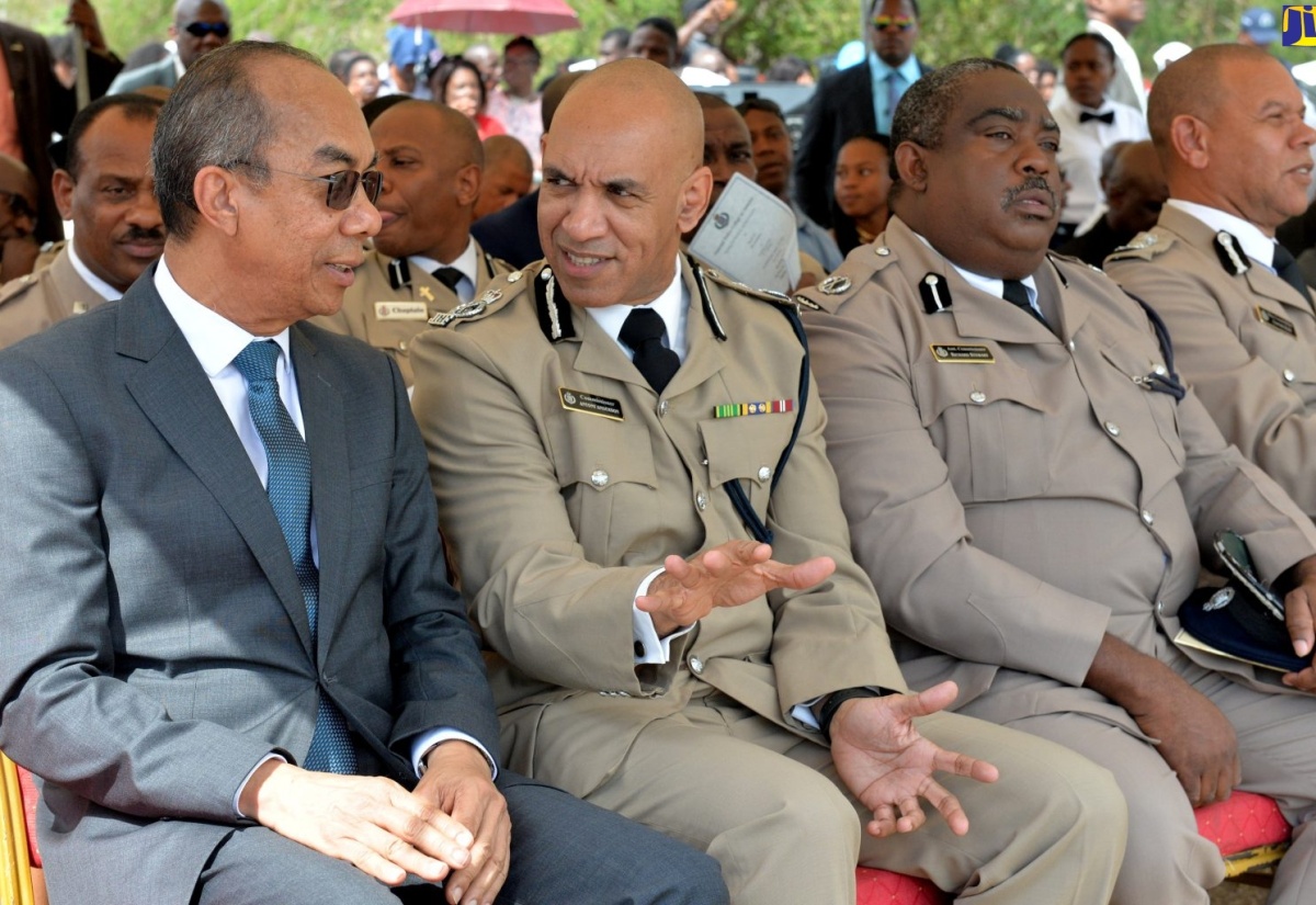 Minister of National Security,  Hon. Dr. Horace Chang (left), speaking with  Commissioner of Police, Major General Antony Anderson (second left), during the Jamaica Constabulary Force (JCF) Passing out Parade and Awards Ceremony, held at The National Police College of Jamaica, in Twickenham Park, St. Catherine, on Wednesday (January 30).  Others (from third left) are Assistant Commissioner of Police, Richard Stewart and Deputy Commissioner of Police, Clifford Blake. 