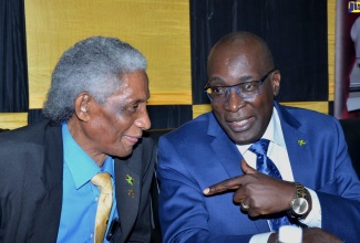 Minister of Education, Youth and Information, Senator the Hon. Ruel Reid (right), in conversation with Pro-Chancellor and Chairman of the Board of Directors, The Mico University College, Professor Neville Ying, during the launch of the Mico International Mathematics Summit at the institution’s premises on Marescaux Road, St. Andrew, on January 30.