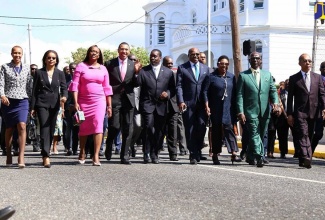 Prime Minister the Most Hon. Andrew Holness (fourth left) and wife and Member of Parliament for St. Andrew East Rural, the Most Hon. Juliet Holness (third left), lead Government Ministers to Gordon House for the Ceremonial Opening of Parliament. From left are Minister without Portfolio in the Ministry of Finance and the Public Service, Hon. Fayval Williams; Attorney General, Marlene Malahoo Forte; Minister of Transport and Mining, Hon. Robert Montague; Minister of Tourism, Hon. Edmund Bartlett; Minister of Culture, Gender, Entertainment and Sport, Hon. Olivia Grange; Minister of Local Government and Community Development, Hon. Desmond McKenzie; and Minister of National Security, Hon. Dr. Horace Chang. 