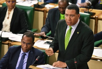 Prime Minister, the Most Hon. Andrew Holness, addresses yesterday's 2019/20 Budget Debate in the House of Representatives on March 19.  To his left is Minister of Finance and the Public of Service, Dr. the Hon. Nigel Clarke.