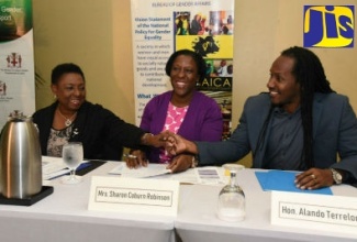 Minister of Culture, Gender, Entertainment and Sport, Hon. Olivia Grange (left), exchanges greetings with State Minister in the Ministry of Education, Youth and Information, Hon. Alando Terrelonge (right), at the launch of the Gender Ambassadors Programme (GAP) on Friday (March 29), at The Knutsford Court Hotel in New Kingtson. Sharing the moment is Acting Senior Director at the Bureau of Gender Affairs (BGA), Sharon Coburn Robinson.