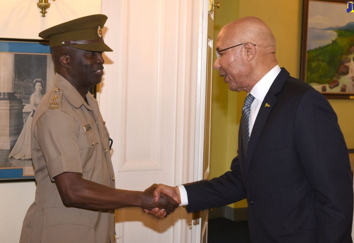 Governor-General, His Excellency the Most Hon. Sir Patrick Allen (right), greets Commanding Officer, Jamaica National Reserve, Lieutenant Colonel Ricardo S. Blidgen, during a courtesy call at King's House on March 28.