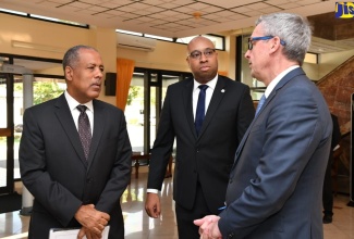 Chief Executive Officer of the Port Authority of Jamaica, Professor Gordon Shirley (left); and Senior Advisor/Strategist in the Ministry of Tourism, Delano Seiveright (centre), converse with Chief Executive Officer of Royal Caribbean International, Michael Bayley, during a meeting in Kingston last week.