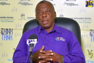 (FILE) Bauxite Community Development Programme Project Coordinator at the Jamaica Bauxite Institute, Clarence Osbourne, addresses a JIS ‘Think Tank’, recently.