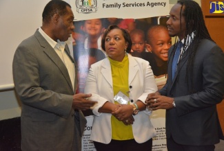 State Minister in the Ministry of Education, Youth and Information, Hon. Alando Terrelonge (right), and Chief Executive Officer, Child Protection and Family Services Agency (CPFSA) Rosalee Gage-Grey (centre), converse with Business Consultant and Clinical Psychologist, Dr. Marcus Mottley, during the CPFSA’s Field Services Conference at Iberostar Rose Hall Hotel in Montego Bay, St James, on Tuesday (April 16). 