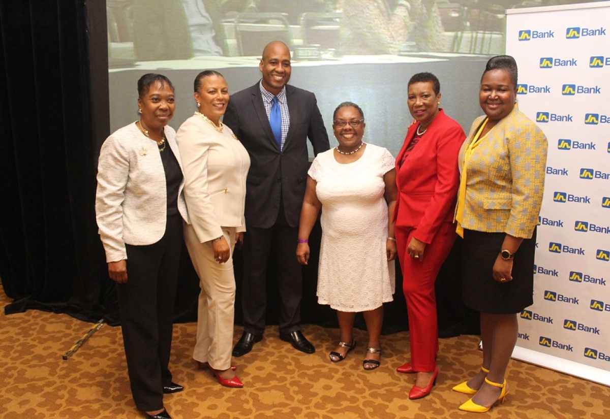 Acting Permanent Secretary in the Ministry of Education, Youth and Information, Dr. Grace McLean (right), along with (from left) Assistant Secretary General in charge of Professional Services at the Jamaica Teachers’ Association (JTA), Dr Margaret Chin; JTA Past President, Nadine Molloy; Head of Business Banking at JN Bank, Ryan Parkes; Senior Lecturer and Head of the institute of Gender and Development Studies, University of West Indies, Mona, Dr. Lieth Dunn; and Deputy Secretary General in charge of Administration, Human Resource and Finance at the JTA, Dr. Charmaine Gooden Monteith, at the 55th staging of the JTA's Education Conference at the Hilton Rose Hall, Resort and Spa, Montego Bay on April 23.