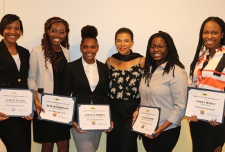 Jamaica’s Ambassador to the United States of America, Her Excellency Audrey Marks (third right),  with the five recipients of the 2019 Jamaica Nationals Association (JNA) College Student Scholarships,  during the JNA’s annual College Student Scholarship Awards. The recipients (from left) are Temera Duncan, Kemesha Robinson, Shannell Hibbert, Justine Brahman, and Ashley Medley. The event was held at the Ambassador’s residence on Saturday, April 6. 

