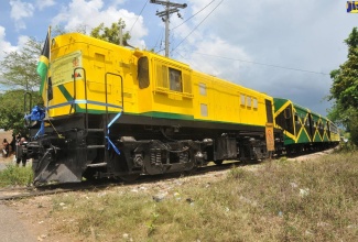 A  reconditioned passenger train embarks on the journey from May Pen to Linstead on April 16, 2011. (FILE)