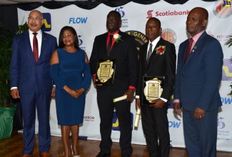 Their Excellencies, Governor-General, the Most Hon. Sir Patrick Allen (left) and Lady Allen;  and Custos of  Kingston, Hon. Steadman Fuller (right), with 2019 Governor-General Achievement Awards (GGAA) recipients from the County of Surrey, Jordon  Freeman (third left) and Calvin Hunter Jr.  The pinning ceremony for nine GGAA awardees from the County of Surrey was held today (April 25), at the Jamaica Conference Centre, in Kingston. 