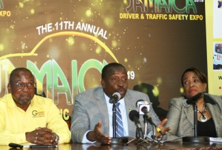 Minister of Transport and Mining, Hon. Robert Montague (centre), addresses the launch of the 2019 Jamaica Driver and Traffic Safety Expo at his Maxfield Avenue offices in St. Andrew on May 21. He is flanked by Chairman of the Expo, Alphonso Grennell (left); and Executive Director of the National Road Safety Council, Paula Fletcher. The expo, organised by Grennell's Driving School, will take place on June 15 at Ranny Williams Entertainment Centre in St. Andrew.  