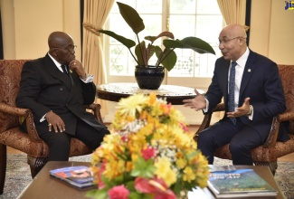 Governor-General, His Excellency the Most Hon. Sir Patrick Allen (right), in conversation with President of the Republic of Ghana, His Excellency Nana Addo Dankwa Akufo-Addo during a courtesy call on King’s House on June 16. The President is on a two-day official working visit to Jamaica.