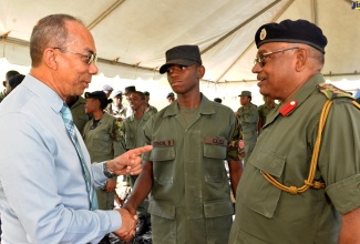 National Security Minister, Hon. Dr. Horace Chang (left), converses with Jamaica Combined Cadet Force (JCCF ) Corporal O’Neil Bailey of Clarendon College (centre), and Custos of St. Mary and JCCF Commandant, Hon. Errol Johnson, during the JCCF’s Inter-Battalion Shooting Competition at the National Police College of Jamaica, Twickenham Park, St. Catherine, on Sunday, June 2.