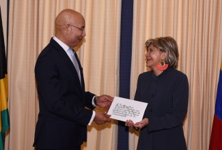 Governor-General, His Excellency, the Most Hon. Sir Patrick Allen, receives Letters of Credence from Ambassador-designate of the Republic of Colombia, Her Excellency Diana Aguilar Pulido, during her courtesy call at King’s House on Friday (June 14).