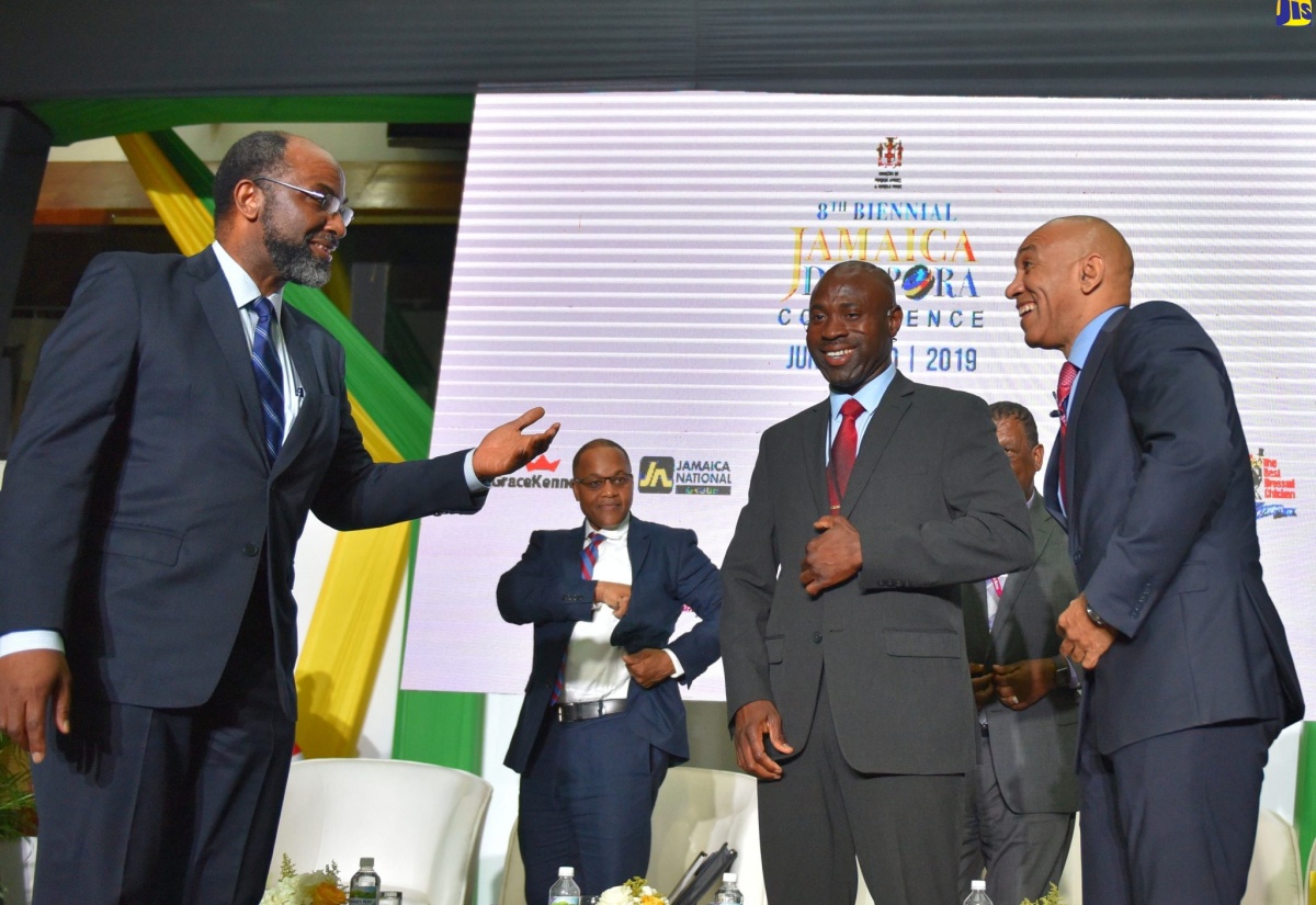 Commissioner of Police,  Major General Antony Anderson (right), enjoys a good laugh with Chief Executive Officer, Jamaica National (JN) Group, Hon. Earl Jarrett (left) and Jamaica Regiment Commander, Jamaica Defence Force (JDF), Brigadier Radgh Mason, at the fifth plenary session of the Eighth Biennial Jamaica Diaspora Conference, on Tuesday (June 18). The four-day event is being held at the Jamaica Conference Centre in downtown Kingston, under the theme ‘Jamaica and the Diaspora: Building Pathways for Sustainable Development’.