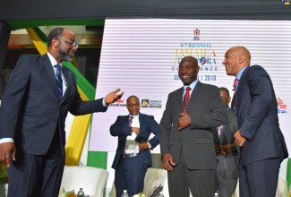 Commissioner of Police,  Major General Antony Anderson (right), enjoys a good laugh with Chief Executive Officer, Jamaica National (JN) Group, Hon. Earl Jarrett (left) and Jamaica Regiment Commander, Jamaica Defence Force (JDF), Brigadier Radgh Mason, at the fifth plenary session of the Eighth Biennial Jamaica Diaspora Conference, on Tuesday (June 18). The four-day event is being held at the Jamaica Conference Centre in downtown Kingston, under the theme ‘Jamaica and the Diaspora: Building Pathways for Sustainable Development’.