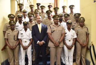 Governor-General, His Excellency the Most Hon. Sir Patrick Allen (front row, third left)  and Major Haughton James (front row, third right), with Officers and Warrant Officers of the Caribbean Institute of Professional Military Education’s Junior Officers’ Course 1901, when they visited King’s House on July 4.