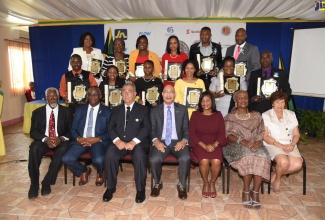 The Excellencies, the Governor-General, the Most Hon. Sir Patrick Allen (centre, seated), and Lady Allen (third right), with Custodes Rotulorum of parishes in the county of Middlesex, and the region’s recipients of the 2019 Governor-General’s Achievement Awards. Seated (from left) are the Custodes of: St. Catherine, Hon. Rev. Jeffrey McKenzie; Manchester -Hon. Garfield Green; Clarendon - Hon. William Shagoury, St Ann - Hon. Norma Walters; and St. Mary - Hon. Maxine Marsh. The awards were presented during a ceremony at the Wembley Centre of Excellence in Clarendon on June 27.