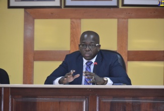 Minister without Portfolio in the Ministry of Economic Growth and Job Creation, Senator the Hon. Pearnel Charles Jr., speaks at a meeting of the Manchester Municipal Corporation, recently.