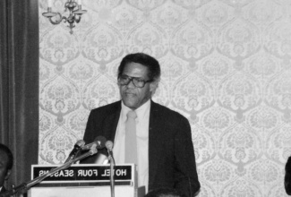 Late Journalist, Ken Chaplin, speaks at a function in earlier times.