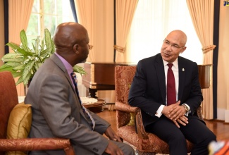 Governor-General, His Excellency, the Most Hon. Sir Patrick Allen  (right), speaks with the High Commissioner of the Republic of Kenya, Mr. Anthony Muchiri, when he called at King’s House on Tuesday (July 2). Mr. Muchiri also presented the Governor-General with his Letters of Credence. 
