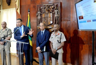 Prime Minister, the Most Hon. Andrew Holness (second left), addresses a press conference at Jamaica  House on Sunday (July 7), where he announced a State of Public Emergency for the St. Andrew South police division. From left are:  Commissioner of Police, Major General Antony Anderson ; Minister of National Security, the Hon. Dr. Horace Chang; and Chief of Defence Staff, Jamaica Defence Force, Lieutenant General Rocky Meade. ​