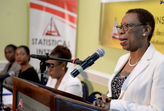 Director General of the Statistical Institute of Jamaica (STATIN), Carol Coy, speaking during Wednesday’s (July 17) quarterly briefing at The Knutsford Court Hotel in New Kingston. Listening (from left) are STATIN’s Senior Statistician and Head of the Indices and Prices Unit, Administrative Statistics Division, Shelly-Ann Chambers; Director of Surveys, Dr. Natalee Simpson; and Deputy Director General, Leesha Delatie-Budair.