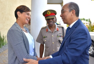 Minister of National Security, Hon. Dr Horace Chang (right), exchanges pleasantries with Pro-Vice-Chancellor and Principal of the University of the West Indies (UWI) Open Campus, Dr. Luz Longsworth (left), ahead of addressing the UWI/Jamaica Defence Force (JDF) Cybersecurity Workshop on Wednesday (July 24), at Up Park Camp, St. Andrew. Sharing the moment is Chief of Defence Staff, JDF, Lieutenant General Rocky Meade. 