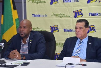 Mayor of Montego Bay, Councillor Homer Davis (right ) and Councillor Dwight Crawford,  listen keenly to questions at a JIS ‘Think Tank’ at the St. James Municipal Corporation  on July 25.