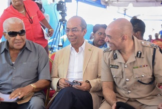 Minister of National Security, Hon. Dr. Horace Chang (centre), in discussion with Member of Parliament for North West St. Catherine, Robert Pickersgill (left), and Commissioner of Police, Major General Antony Anderson, while at the ceremonial opening of the Shady Grove Police Station in Lluidas Vale, St. Catherine, on August 9.