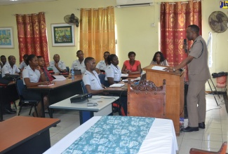 Head of the St James Police, Superintendent Vernon Ellis (right), speaks to officers during a School Resource Officers’ Seminar at the Freeport Police Station in Montego Bay on Wednesday (August 28).