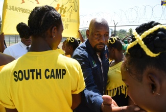 Minister of State in the Ministry of National Security, Hon. Rudyard Spencer (centre), interacts with female wards attending the 2019 staging of the ‘We Transform’ Sports and Fun Day, held at the Rio Cobre Juvenile Correctional Centre in Spanish Town, St. Catherine, today (August 20).