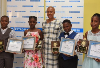 Minister of Science, Energy and Technology, Hon. Fayval Williams (centre),  with top performing Primary Exit Profile (PEP) students at the Petrojam’s 2019 scholarship awards luncheon, held today (August 23), at the Jamaica Business Development Corporation (JBDC) Resource Centre, on Marcus Garvey Drive, in St. Andrew.  With the Minister (from left) are: Matthew Jeffrey, Terry-Ann McFarlane, Daniel Grant and Jodi Green.