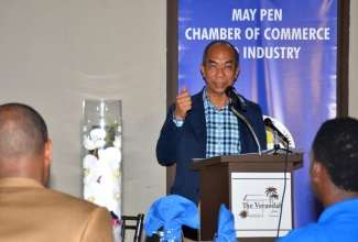 Minister of National Security, Hon. Dr. Horace Chang, delivers the main  address at the  Jamaica All-Island Chambers of Commerce quarterly luncheon, held  in Clarendon on August 17.