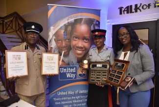 Assistant Commissioner of Police (ACP) Gary Welsh (left), along with Woman Sergeant Tanya Layne (centre) and Woman Inspector Barbara Robinson, display awards which the Jamaica Constabulary Force (JCF) and several of its members received at the United Way of Jamaica (UWJ) Nation Builders’ and Employees Awards ceremony, held recently at the Jamaica Pegasus Hotel in New Kingston.