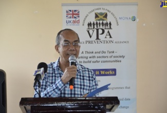 Minster of National Security, Hon. Dr. Horace Chang, speaks at a Violence Prevention and Peace Building Symposium, hosted by the Violence Prevention Alliance (VPA), in partnership with the Ministry of National Security, at the Montego Bay Community College, St. James, on September 26.

