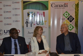 Minister of Justice, Hon. Delroy Chuck (right), in discussion with High Commissioner of Canada to Jamaica, Her Excellency Laurie Peters (centre); and Custos Rotulorum of St. James, Bishop the Hon. Conrad Pitkin, during the opening session of the Train the Trainer session: Lay Magistrates’ Court, held at the Hilton Rose Hall Resort and Spa, Montego Bay, St. James, on Saturday (September 28).