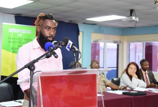 Road safey advocate Maleek Powell speaking at the Ministry of Transport and Mining's inaugural Symposium on Traffic Crash Investigation and Black Box Analysis held at the Caribbean Maritime University (CMU) in August. 