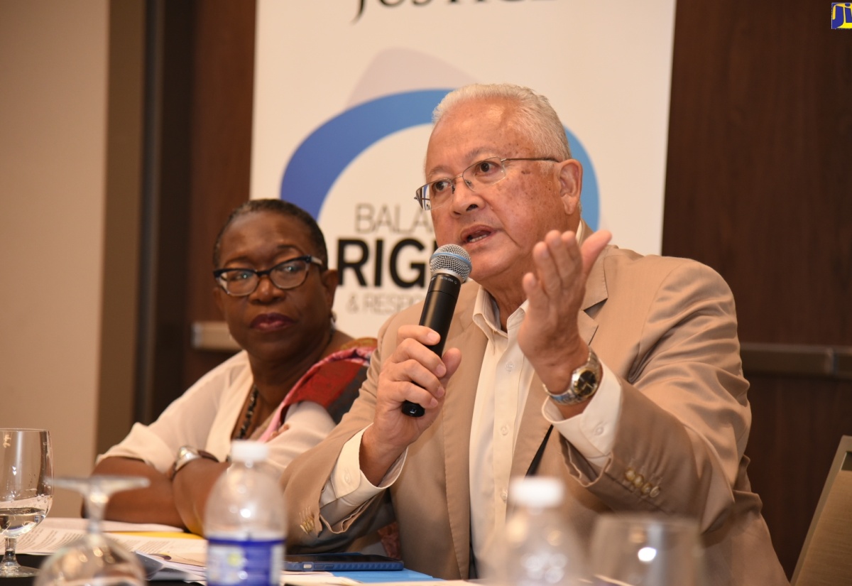 Justice Minister, Hon. Delroy Chuck, speaking at the opening ceremony of an Anti- Corruption Training Seminar on Saturday (October 26) at the AC Marriott Hotel, St. Andrew. Looking on is Director of Public Prosecutions (DPP), Paula Llewellyn. The training session was organised by the Office of the DPP. 