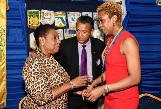 Minister of Culture, Gender, Entertainment and Sport, Hon. Olivia Grange (left), in discussion with (from second left), Past President of the Rotary Club of Spanish Town, Roy Lafayette; and President of the club, Gail Dixon, shortly before the start of a meeting of the club at the Police Officers’ Club in St. Andrew, on Tuesday (October 15). Minister Grange was guest speaker at the event.