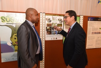 Acting Chief Planning Analyst in the Ministry of Industry, Commerce, Agriculture and Fisheries, Clifford Spencer (left), speaking with Food and Agriculture Organization (FAO) Trade and Markets Officer for Latin America and the Caribbean, Juan Cheaz Pelaez, during the recent ‘Climate Change and the Future of Food Security: Positioning Agro-Food Systems for our Health and Wealth’ public forum, at the University of the West Indies, Mona, St. Andrew.