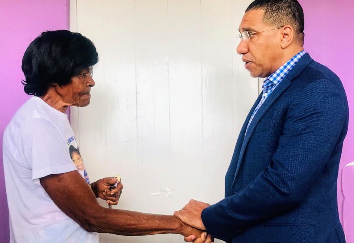 PM Presents Keys to Fire Victims in Kingston